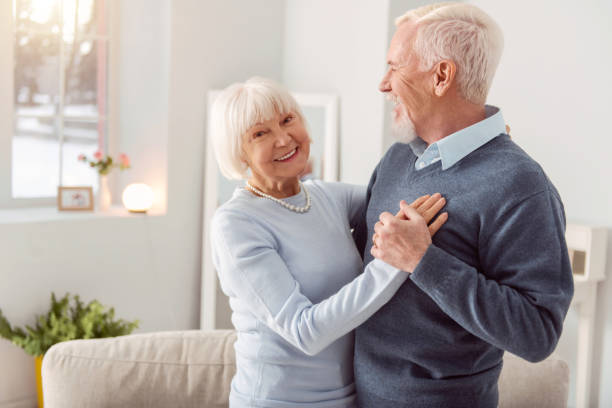 istock Happy elderly couple dancing waltz and smiling 935628514