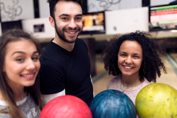 istock College students at the bowling alley 935630732