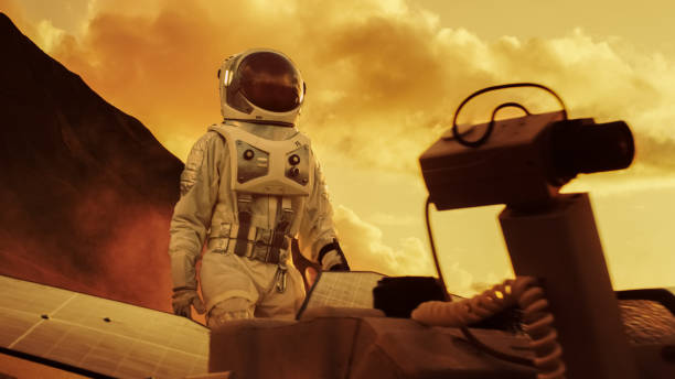 istock Astronaut on Mars Walking on the Exploring Expedition. In the Background His Base/ Research Station. First Manned Mission To Mars, Technological Advance Brings Space Exploration, Colonization. 935640174