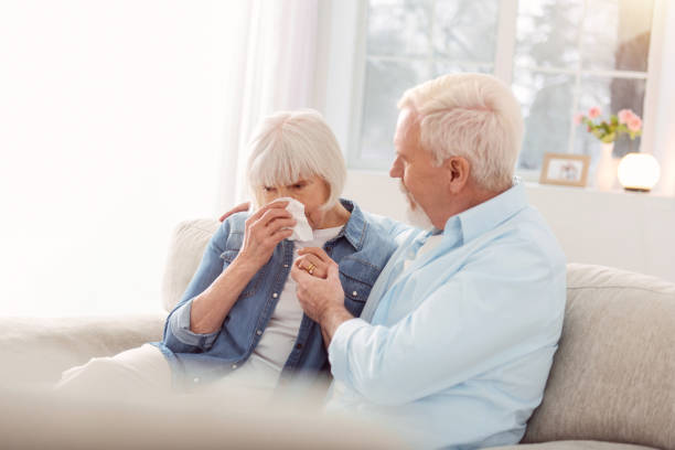 istock Loving senior man cheering up his crying wife 935641822