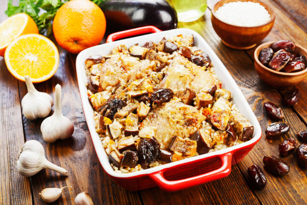 istock Chicken thigh baked with rice, eggplant and figs 935643010