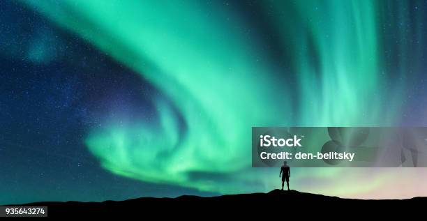Aurora Borealis And Silhouette Of Standing Man Stock Photo - Download Image Now - Aurora Borealis, Aurora Polaris, Finland