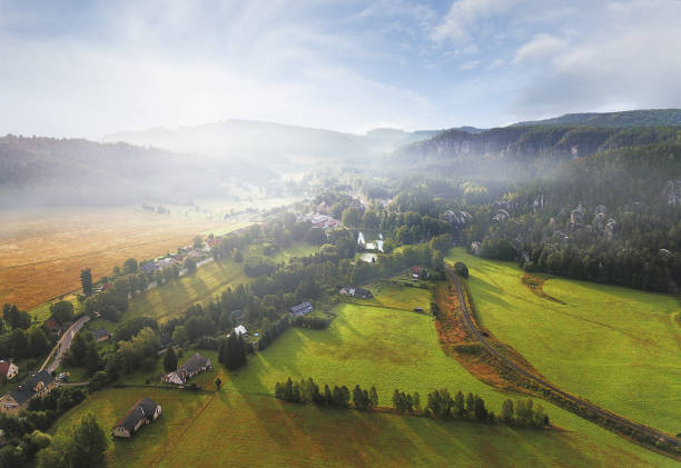 Adrspach Teplice rocks Drone point of view at picturesque misty valley of Adrspach Teplice rocks in the autumn morning sun. The Adršpach-Teplice Rocks climbing area (Czech: Adršpašsko-teplické skály, German: Adersbach-Weckelsdorfer Felsenstadt) are an incredibul set of sandstone formations. bioreserve photos stock pictures, royalty-free photos & images