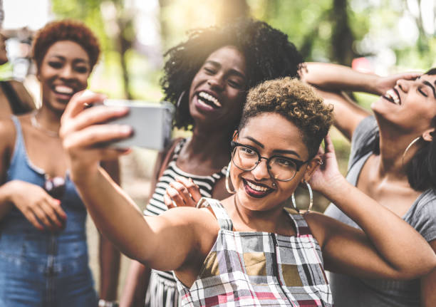 istock Multiracial group of friends taking selfie 935649256