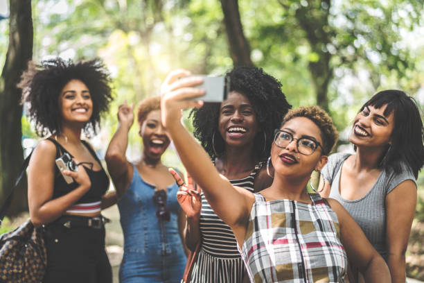 istock Multiracial group of friends taking selfie 935649272