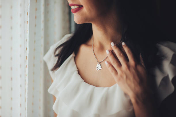 Silver necklace with larimar stones, close up photo with selective focus