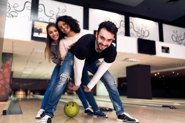 istock Teamwork at the bowling alley - having fun 935649518