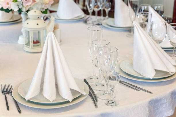 istock Table with glasses and napkins served for dinner in restaurant 935649768