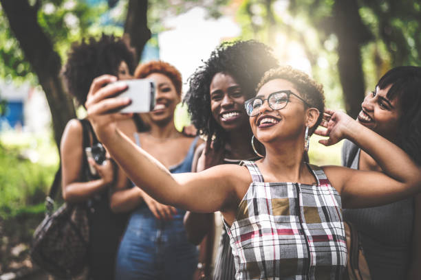 istock Multiracial group of friends taking selfie 935649860