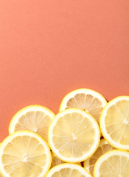istock slices of lemon on salmon background 935652460
