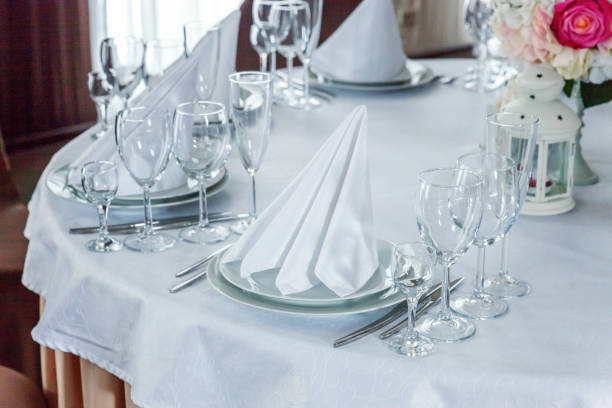 istock Table with glasses and napkins served for dinner in restaurant 935652780