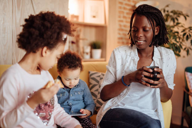 istock Cute African family having breakfast 935652856