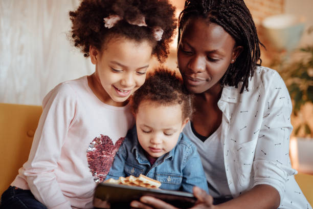 istock Cute family looking at tablet 935653152