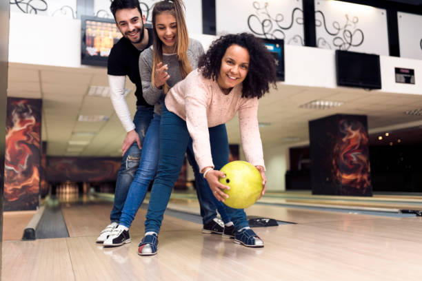 istock Teamwork at the bowling alley - concept 935653822