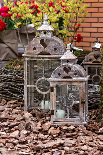 istock Garden composition in a decorative lantern. Garden decoration 935658810
