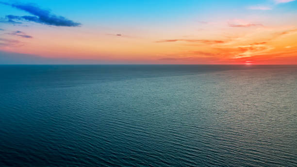 istock Delicious delicate sunset over a calm sea 935658868
