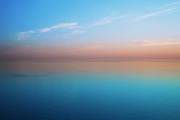 istock Delicious delicate sunset over a calm sea 935658944