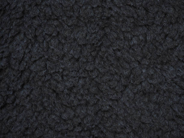 close-up dunkel grauer wolle textur. strickwaren, hintergrund der oxford-grauen flauschige wolle. vlies-schafe - fleece coat stock-fotos und bilder