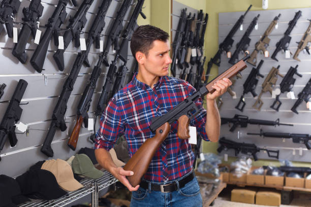 istock Male is choosing air-powered gun 935659106