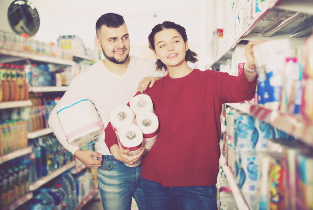 istock Man and girl selecting toilet paper 935664936