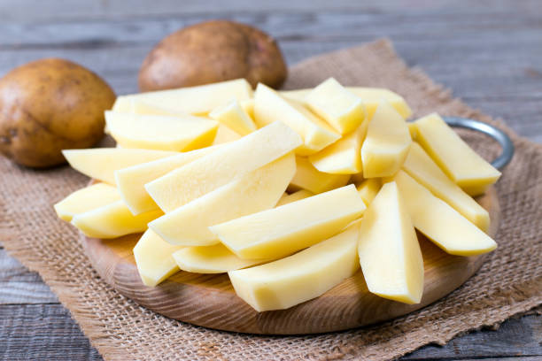 istock Fresh homemade potato pieces on the cutting board 935665434