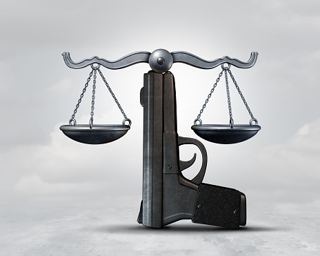 Gun law and weapon legislation concept as a handgun shaped as a justice scale as a legal rights idea as a 3D illustration.