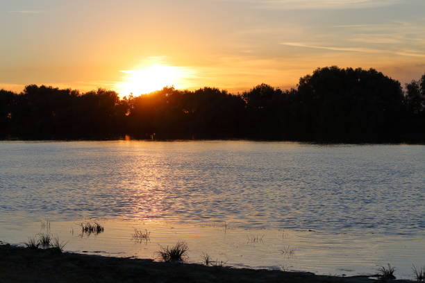 istock Colorfull sunset at the river bank 935675000