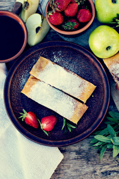 istock Strudel with apples and strawberries. 935677828