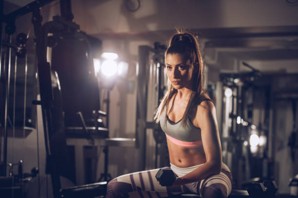 istock Fitness woman exercise with dumbbell 935678136