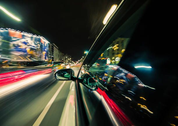 istock Car driving at night in the city 935681078