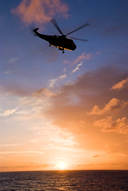 istock Silhouette of helicopter 935684326