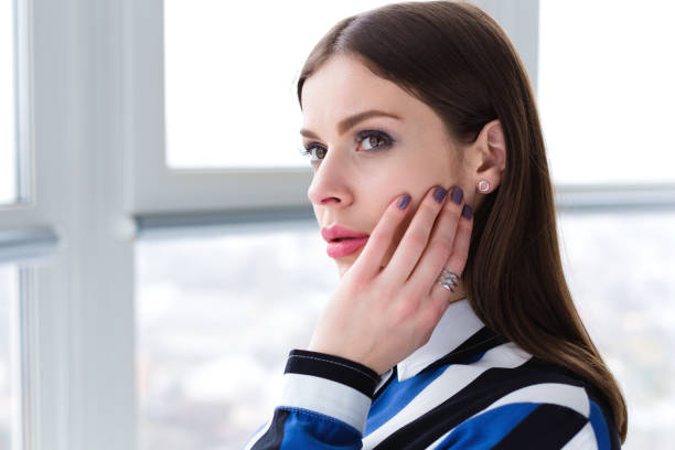 istock Beautiful daydreaming woman 935691728