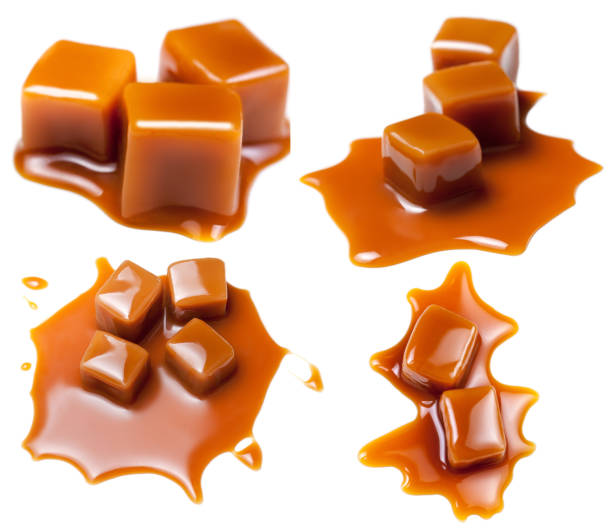istock Caramel with sauce. Golden Butterscotch toffee candy caramels. Sweets  with copy space, macro. 935692504