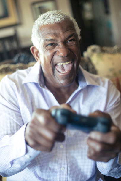 istock Senior Black Man Playing Video Games 935698624