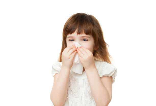 istock Girl 4-5 years snotting nose on white background 935698698