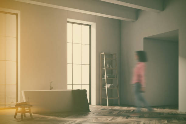 istock White tub in a gray bathroom corner blur 935702000