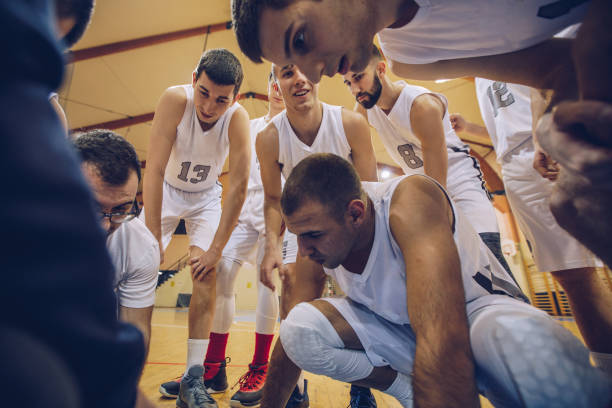 istock Coach talking to a basketball players 935702612