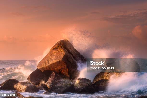 Tropical Beach With Rocks And Big Crashing Waves Stock Photo - Download Image Now - Rock - Object, Sea, Wave - Water