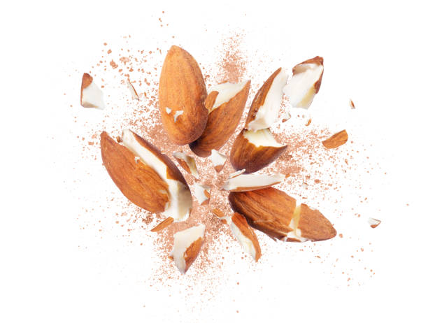 istock Almonds is torn to pieces close-up on white background 935708276