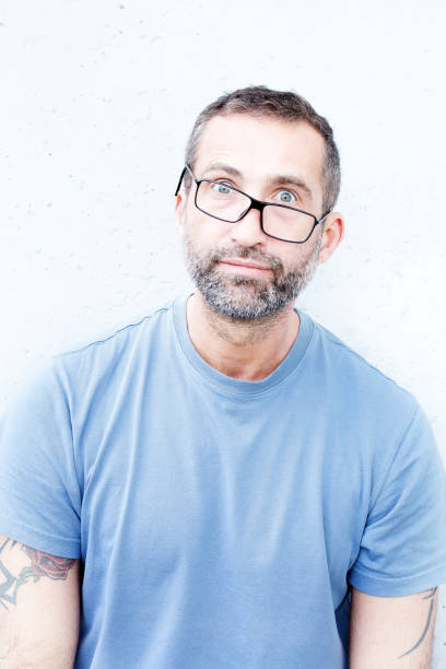 istock handsome bearded man with crooked eyeglasses 935708344