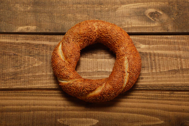 istock Simit-Turkish Bagel on Wood Background 935709008