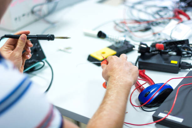 istock Electrician soldering wires. 935709112
