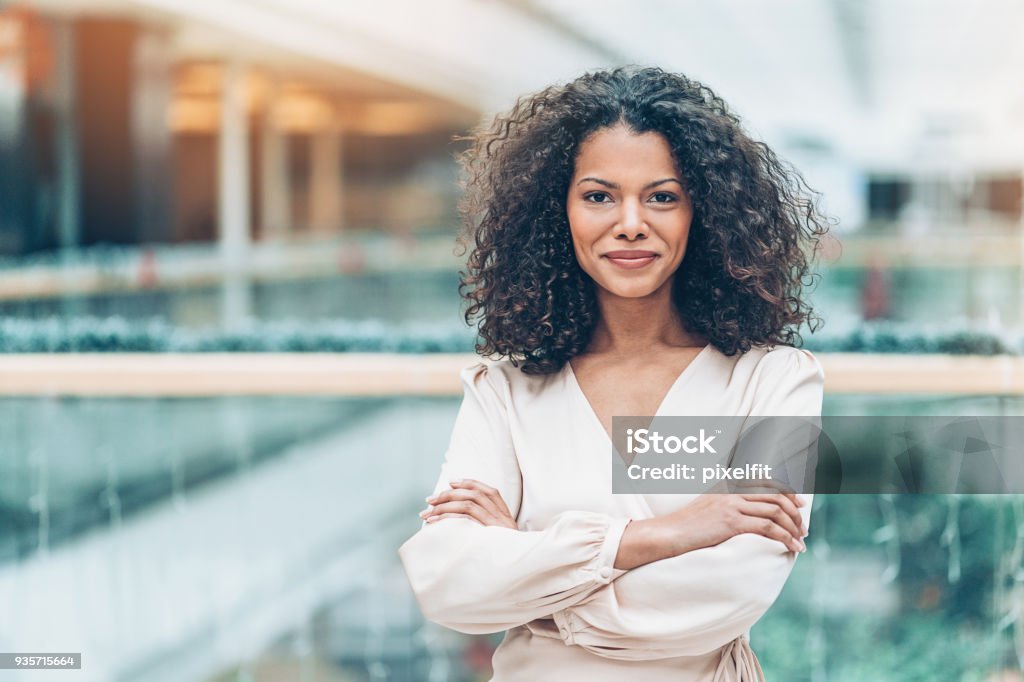 Young African ethnicity businesswoman Businesswoman with arms crossed looking at camera Businesswoman Stock Photo