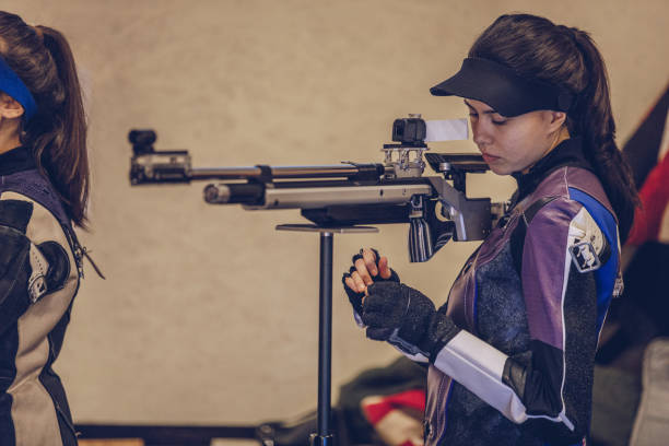 istock Young woman shoots at the shooting range 935717906