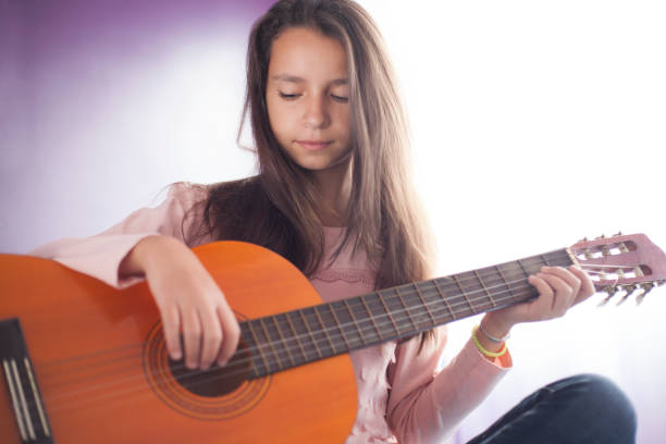 istock Girl with guitar 935721958