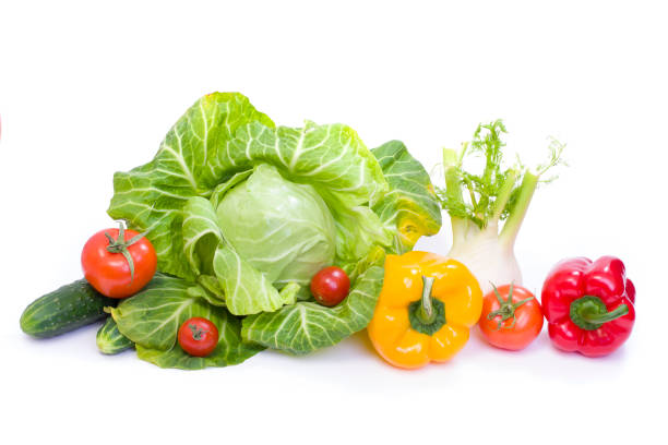 istock Green cabbage. Red and yellow pepper. Red tomatoes. Composition from different vegetables on a white background. 935729320