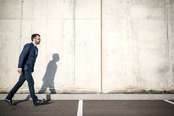 istock Well-dressed businessman in a hurry for work 935732432
