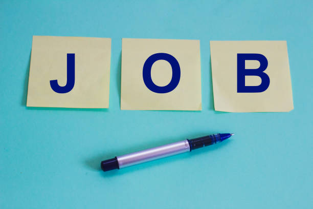 istock JOB text on note papers and a pen against blue background, Business concept 935732854