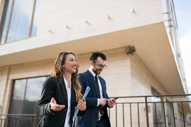istock Business couple ordering food while walking outside 935735878