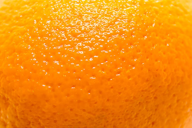 Ripe Orange Background Orange fruit texture closeup skin feature stock pictures, royalty-free photos & images